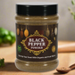 A container of Organic Black Pepper Powder with a label that includes decorative elements and text highlighting the product name and usage.